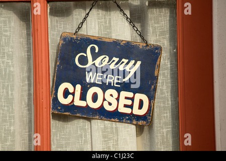 Sorry we're closed sign in shop window Stock Photo