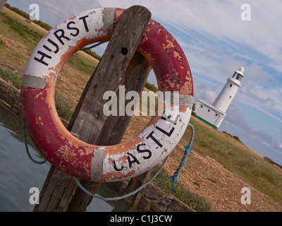 Lifebelt with Lighthouse at Hurst Castle, Hurst Spit, Keyhaven, Hampshire, England, UK in the background. Stock Photo