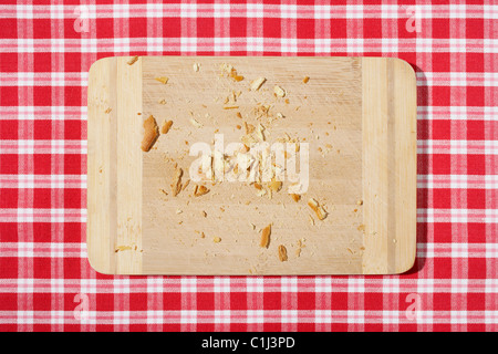 Cutting Board with Bread Crumbs Stock Photo