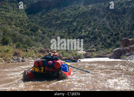 2 couples rafting on the Salt River in Arizona, USA on inflatable pontoon boats. Stock Photo