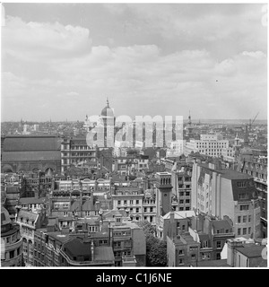 1950s, aerial view over the rooftops of Cheapside and the City London from The Monument, showing the dome of St Paul's Cathedral in the distance. Stock Photo