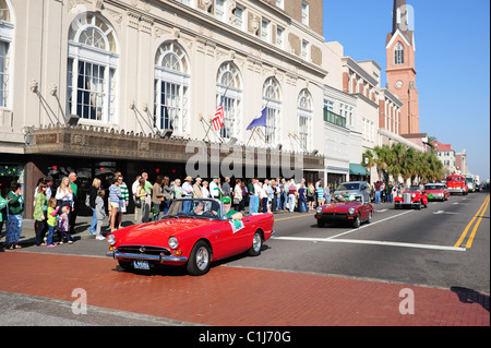 Parade of vintage cars in St. Patrick's Day Parade: Pictured are British Triumphs, an MG, and in the background a fire engine Stock Photo