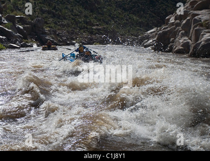 2 couples rafting on the Salt River in Arizona, USA on inflatable pontoon boats. Stock Photo