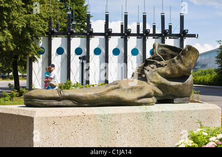 Quebec City, Quebec, Canada. Giant bronze 'clown shoe' sculpture outside Cirque du Soleil headquarters, Old City. Stock Photo