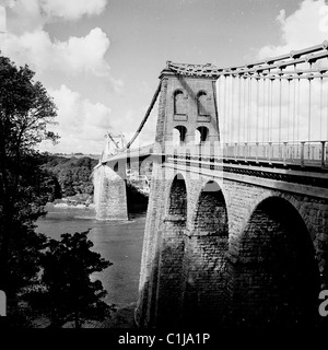 1960s, historical, the Menai Suspension Bridge, Wales, designed by Thomas Telford and the world's first major suspension bridge, opened in 1826. Stock Photo