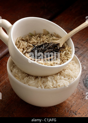 Wild rice brown and Basmati in measuring cups Stock Photo