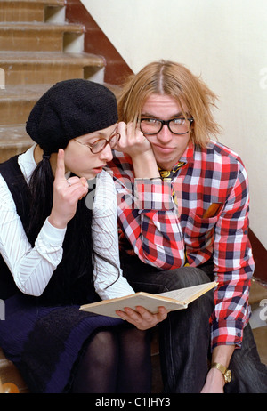 lazy and boring students read a book Stock Photo