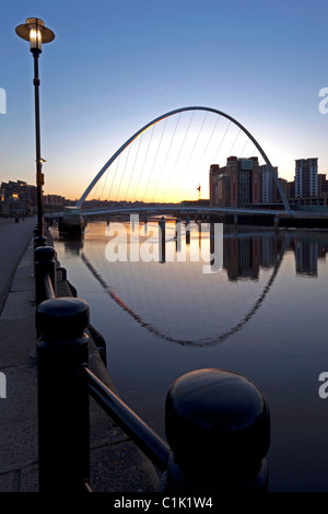 Gateshead Millennium Bridge at dawn, reflected on the River Tyne, from the Newcastle Quayside, Newcastle upon Tyne, Tyne & Wear Stock Photo