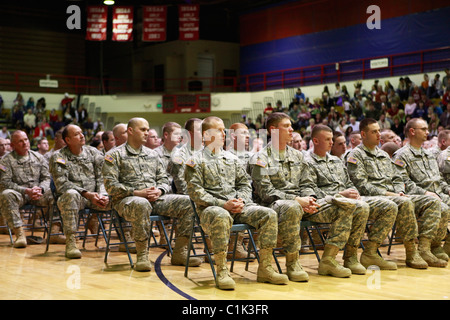 Soldiers sit in chairs during a deployment ceremony for the Bedford, Ind. based 2219th Brigade Support Company of the Indiana Na Stock Photo