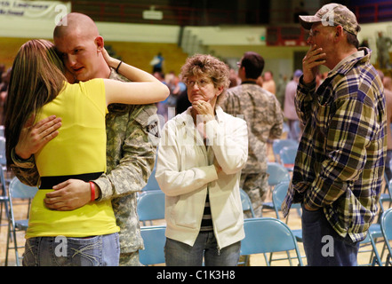 A soldier's parents show their emotion during a ceremony for the Bedford, Ind. based 2219th Brigade Support Company of the India Stock Photo