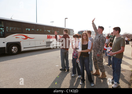 Family members wave goodbye to soldiers of the Bedford, Ind. based 2219th Brigade Support Company of the Indiana National Guard Stock Photo