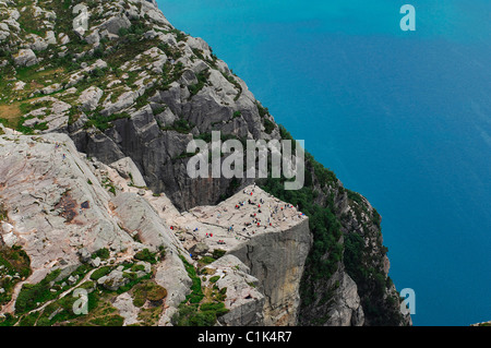 Norway, Rogaland, hikers on the Pulpit Rock (Preikestolen) in the Lysefjord - fjord of Lysebotn (aerial view) Stock Photo