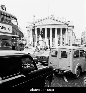 1960s, traffic congestion in the city of London at Bank, a major road junction with landmark buildings such as the Royal Exchange seen here. Stock Photo