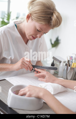 Woman Getting a Manicure, Vancouver, British Columbia, Canada Stock Photo