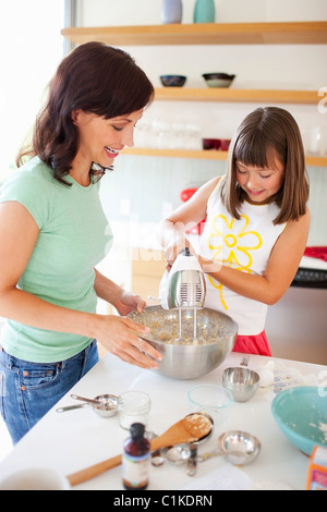 Mother and Daughter Baking Cookies, Portland, Oregon, USA Stock Photo
