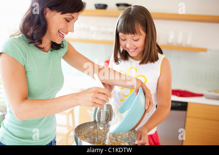 Mother and Daughter making Cookies, Portland, Oregon, USA Stock Photo