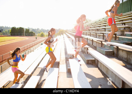 Teenagers Running up Bleachers at Race Track, Lake Oswego, Oregon, USA Stock Photo