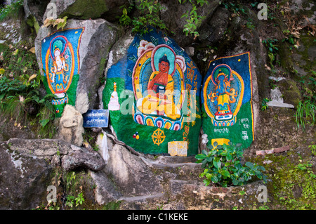A colorful buddhist paintings on the rocks in Dalhousie, India. Stock Photo