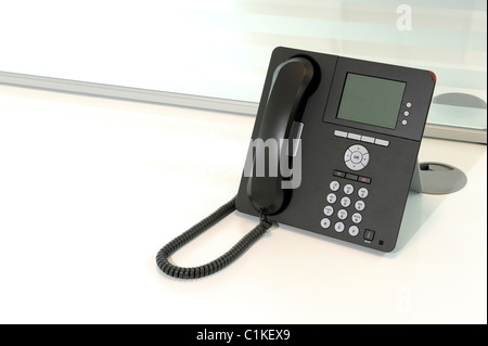 Office phone on a desk Stock Photo