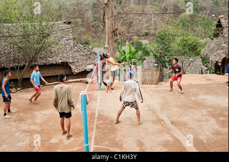 Teenage boys playing a game of Sepak takraw in the Mae La refugee camp, Tak province, Thailand, Asia. Stock Photo