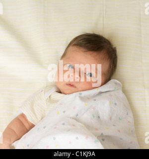 Baby Wrapped in Blanket Stock Photo