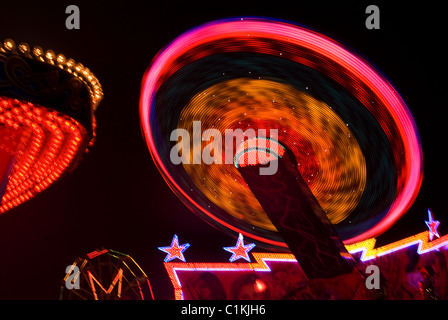 Colorful fairground ride at night at the Great Dorset Steam Fair Stock Photo