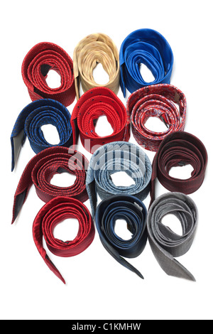 Varicoloured male ties convolute ring on white background Stock Photo