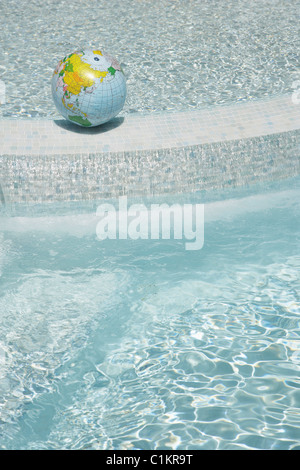 Beach Ball Globe in Swimming Pool, Sanary-sur-Mer, Var, Provence, Provence-Alpes-Cote d'Azur, France Stock Photo