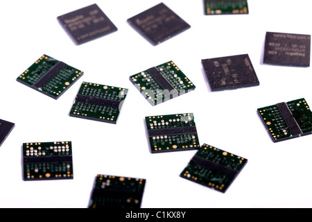 Close view of a bunch of computer memory chips isolated on a white background. Stock Photo