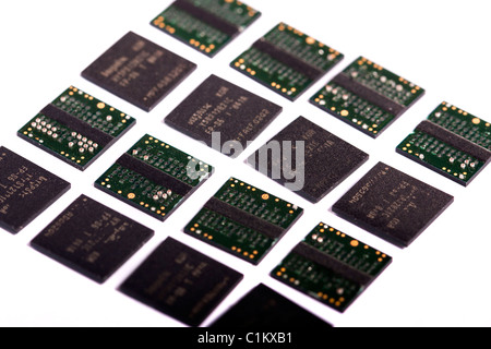 Close view of a bunch of computer memory chips isolated on a white background. Stock Photo