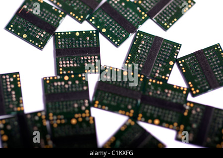 Close view of a bunch of computer memory chips isolated on a white background. Stock Photo