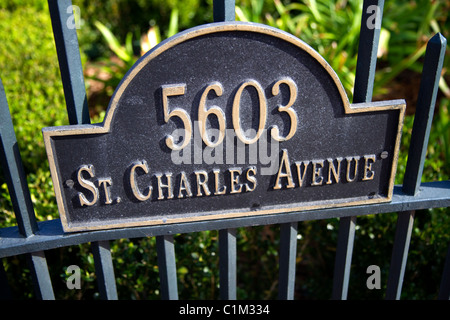 Address sign on the gate of the McCarthy House on Saint Charles Avenue in the Garden District of New Orleans, Louisiana, USA. Stock Photo