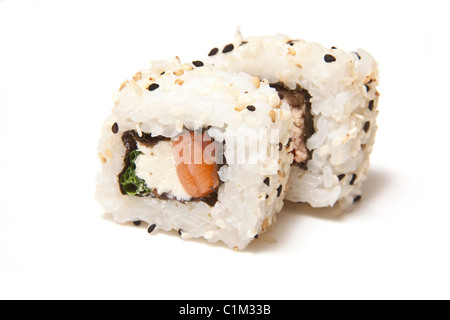 Salmon and cream cheese sushi roll isolated on a white studio background. Stock Photo
