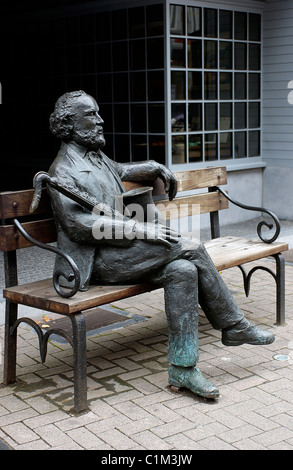 Belgium, Wallonia, province of Namur, city of Dinant, statue of Mr Saxo inventor of the saxophone Stock Photo