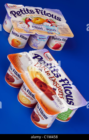 Two Packets of four different flavoured pots of Petits Filous little dairy desserts Stock Photo