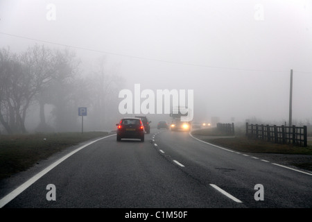 Cars driving in fog. Stock Photo