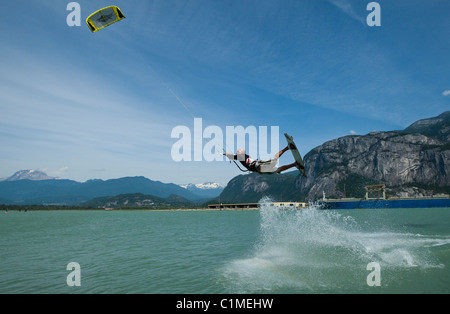 A kiteboarde is airborne at 'the Spit',Squamish, BC, Canada Stock Photo