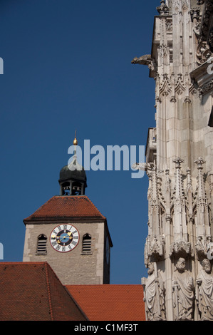 Germany, Bavaria, Regensburg. Gothic St. Peter's Cathedral (13th - 16th century), historic clock tower in distance. Stock Photo