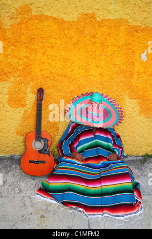 Mexican typical lazy man sombrero hat guitar serape nap siesta Stock Photo