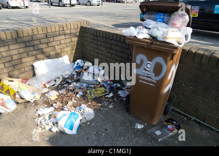 Overflowing wheelie bin Stock Photo