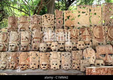 Mayan wood mask rows Mexico handcraft faces indian culture Stock Photo