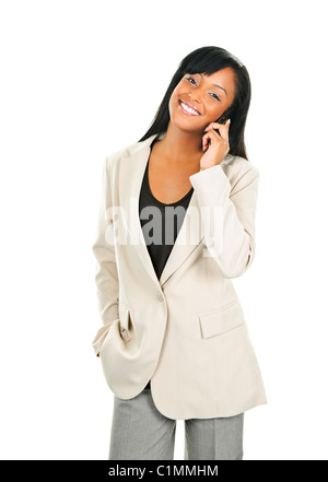 Young smiling black businesswoman on cell phone isolated on white background Stock Photo