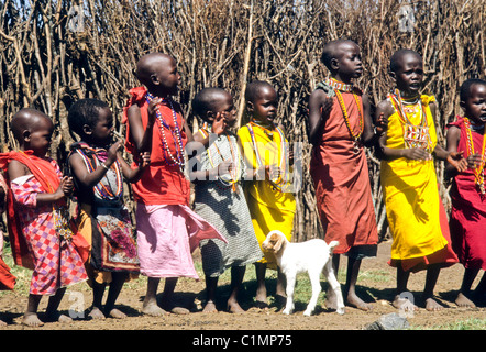 Maasai children singing, Masai Mara, Kenya Stock Photo