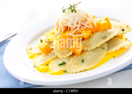 Gourmet squash ravioli dinner served with cheese on plate