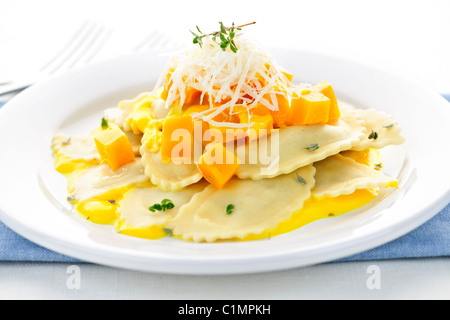 Gourmet squash ravioli dinner served with cheese on plate
