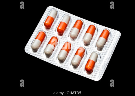 Capsules packed in blister isolated on black ground Stock Photo