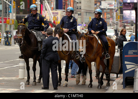 United States, New York City, Manhattan, Times Square, police officers riding horses Stock Photo