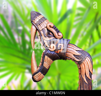 Chichen Itza Snake symbol wood handcraft figure in jungle Mexico Yucatan Stock Photo