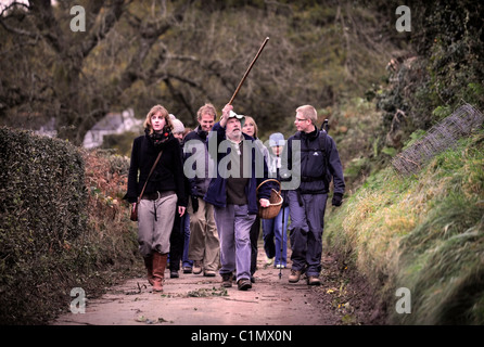 Foraging expert Raoul Van Den Broucke leads a tour party through lanes near Upper Llanover Gwent Wales UK Stock Photo