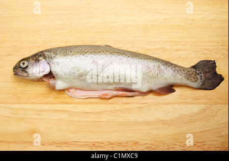 Fresh rainbow trout on a wooden board Stock Photo